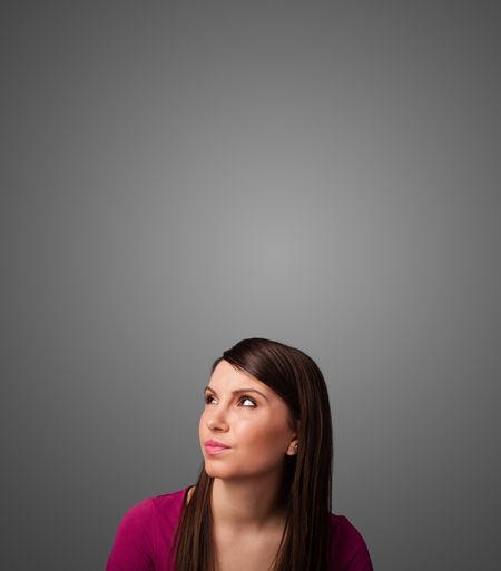 pretty-young-woman-gesturing-empty-space-213926167 Pretty young woman gesturing with empty space