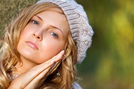 sexy autumn blond girl portrait outdoors in a park