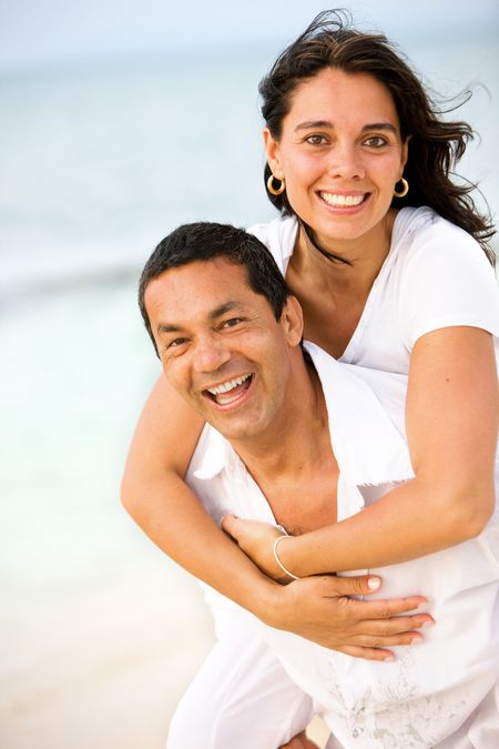 happy beach couple smiling and having fun