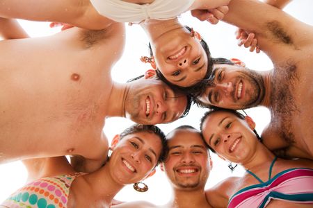 happy friends smiling at the beach - young people