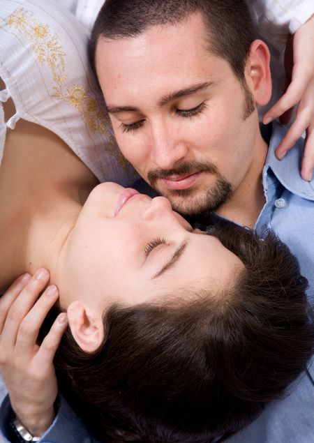 couple in love on the floor looking at each other