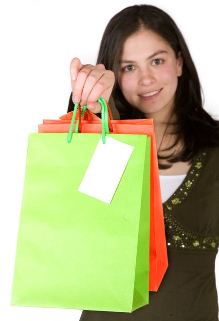 beautiful girl with shopping bags over white