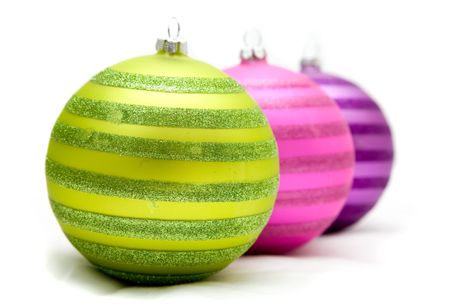 christmas balls lying on a soft surface in unusual colours