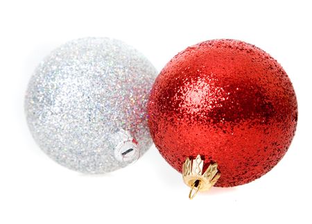christmas balls focus on hook of closer ball with shallow depth of field on white
