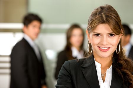 business woman portrait in an office smiling