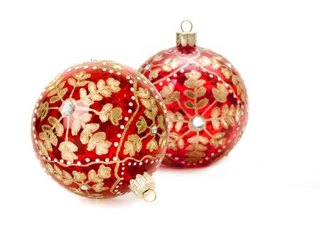 christmas balls focus on hook of closer ball with shallow depth of field on white