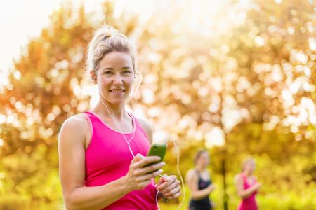 attractive woman listening to music during sport