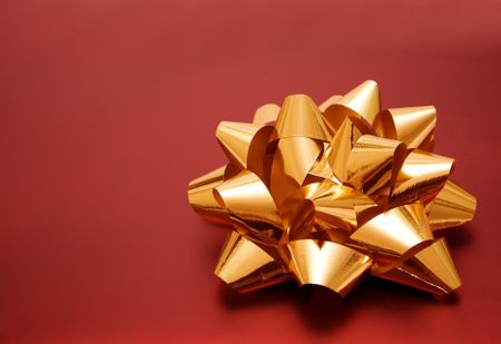 beautiful golden ribbon on red gift 1