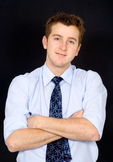 business man portrait over a black background