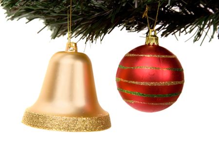 christmas ball and bell on a xmas tree over a white background