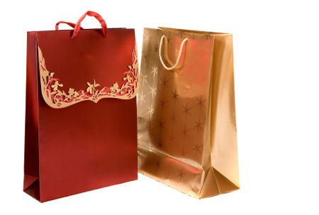 christmas shopping bags over a white background