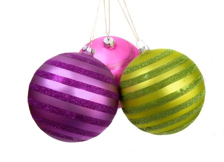 christmas baubles hanging over a white background