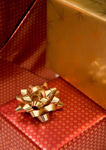 gifts close up in gold and red colours