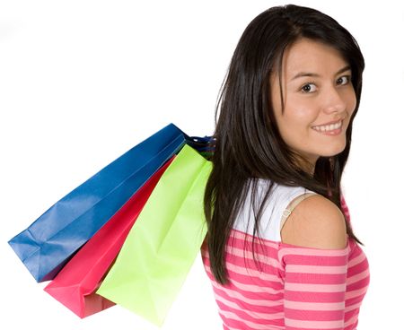 girl in pink with shopping bags over white