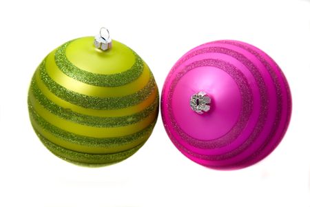 pair of christmas baubles in attractive colours over a white background