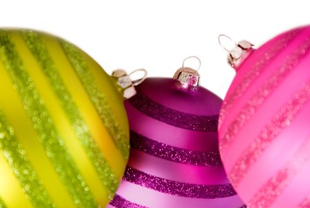 colourful christmas balls over a white background
