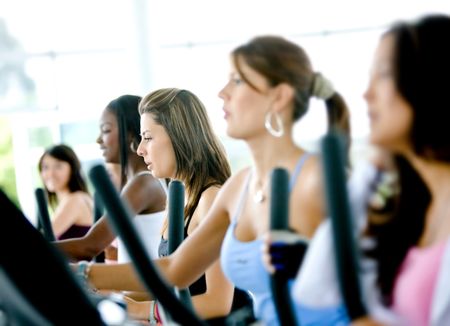 group of women doing cardio in a gym
