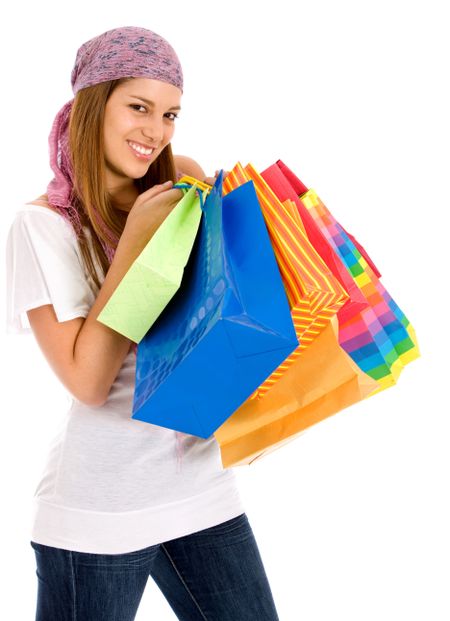 beautiful casual woman standing with shopping bags isolated over a white background