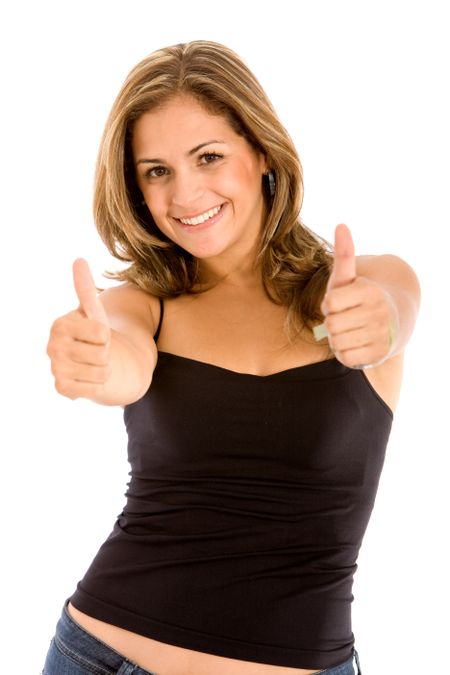 casual woman smiling with her thumbs up - isolated on white