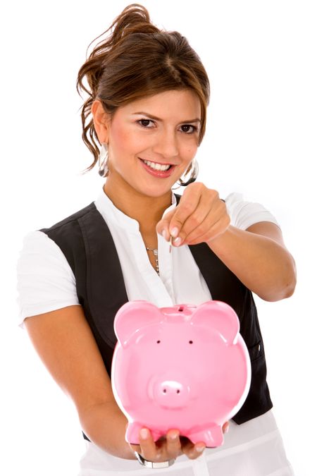 casual woman saving money in a piggybank - isolated on white