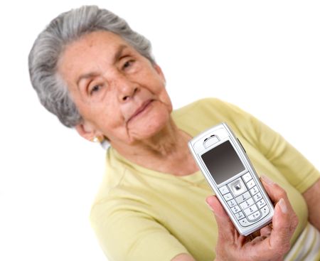 grandmother with a mobile phone on her hand over a white background - focus is on mobile phone