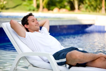 casual man relaxing on his holiday home