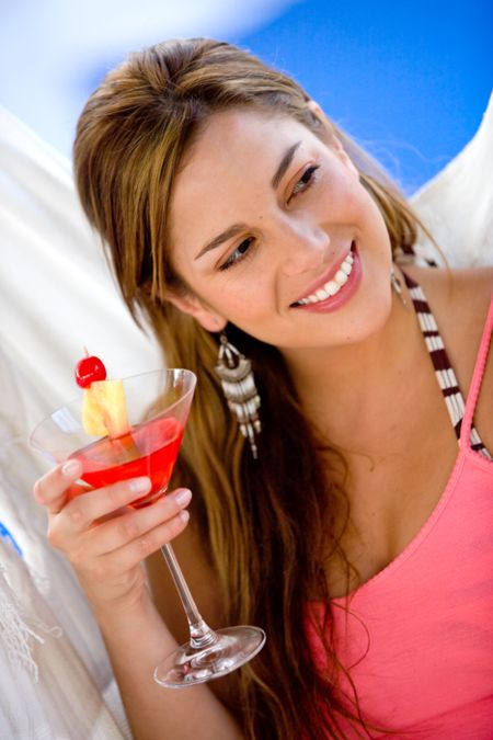 woman-having-cocktail-drink-vacation-22030786 woman having a cocktail drink while on vacation