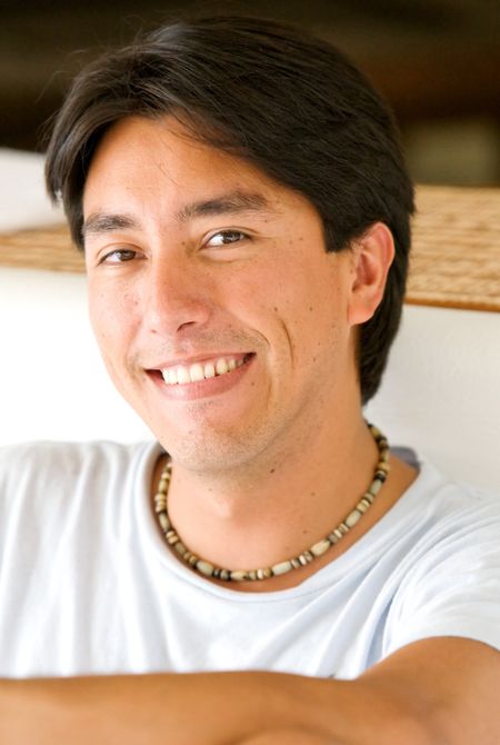 casual male portrait smiling in his summer house