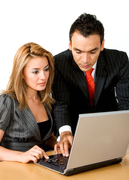business couple working on a laptop computer isolated over a white background