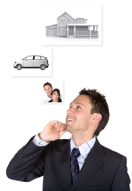 business man with personal goals on the wall: family - car and a house