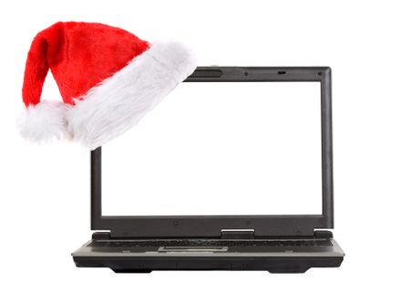 christmas laptop with a hat on the screen over white