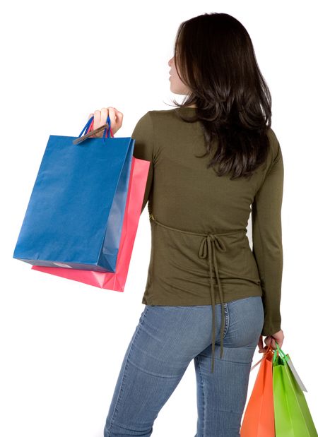 Beautiful girl taken from behind with shopping bags