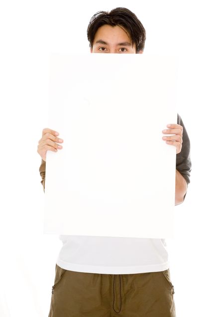 casual guy hiding behind a white board over a white background