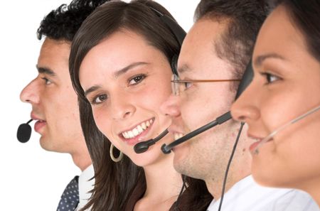 customer suppor team over a white background - focus is on the girl facing the camera