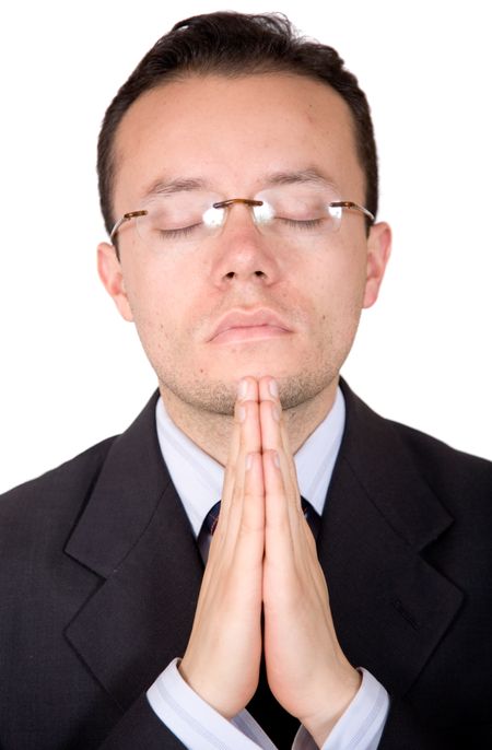 business man praying over a white background