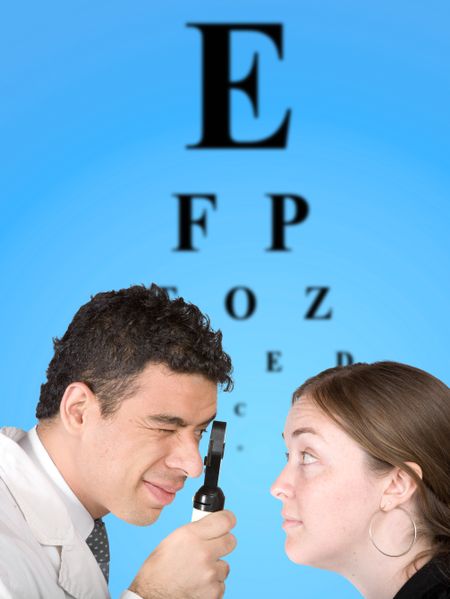 eye test - doctor and patient with the eye chart in the background