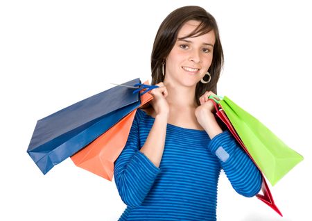 beautiful young girl carrying shopping bags over a white background