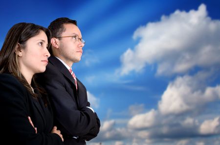 business partners looking for success on a business graph showing a big growth