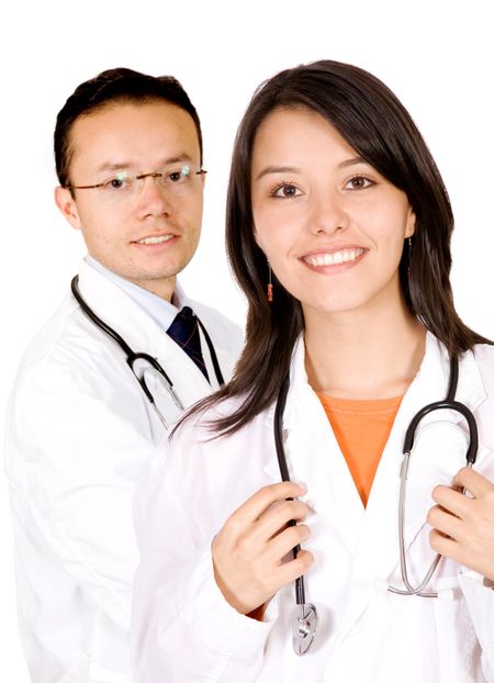 friendly young doctors smiling over a white background