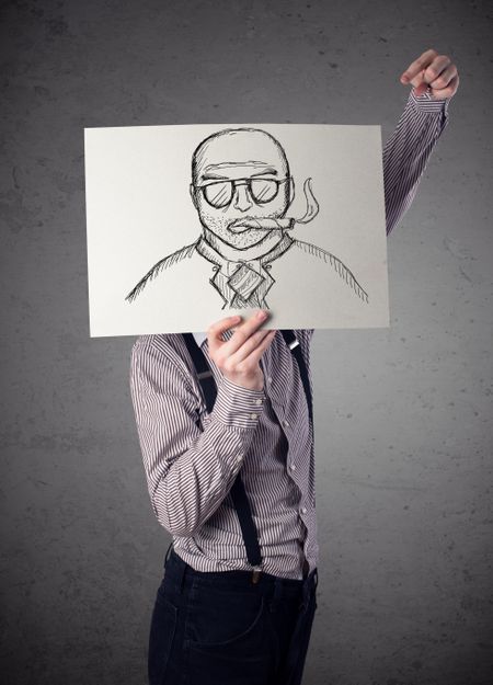 Businessman holding a cardboard with a smoking man on it in front of his head