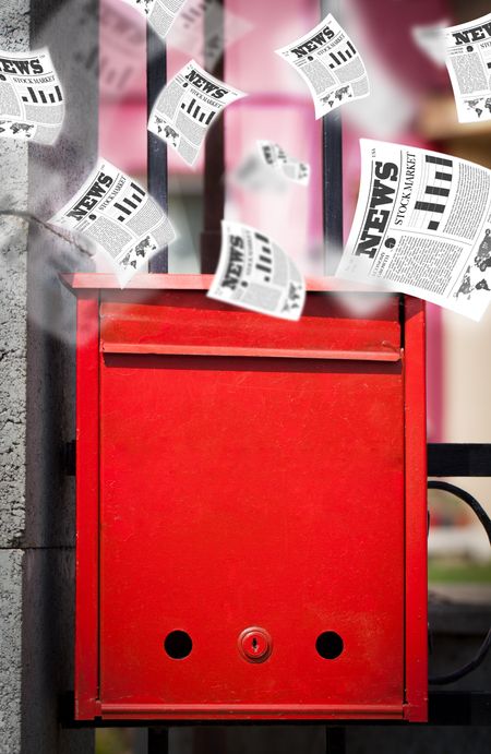 Post box with daily newspapers flying out