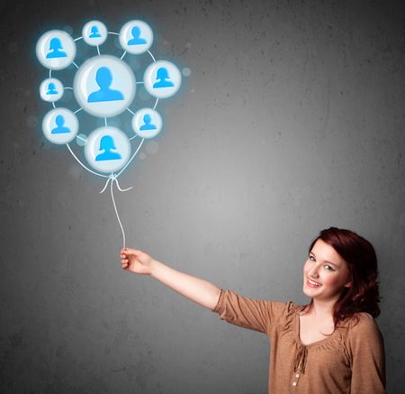 Young woman holding social network balloon