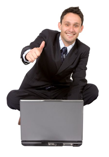 business man on laptop with a positive attitude over a white background