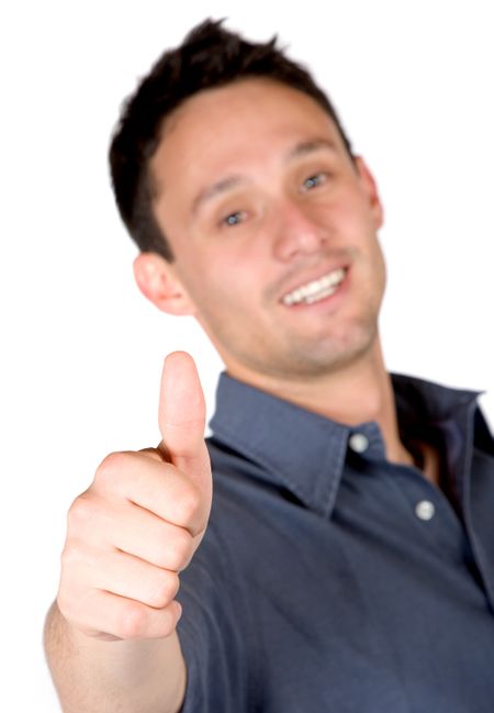 casual man with his thumb up while smiling over a white background