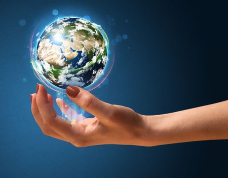 Young woman holding in her hand a glowing earth globe, Elements of this image furnished by NASA