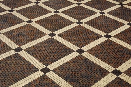 Checkered pattern of brick mosaic plaza