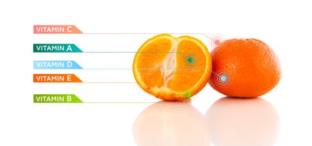 Healthy fruits with colorful vitamin symbols on white background