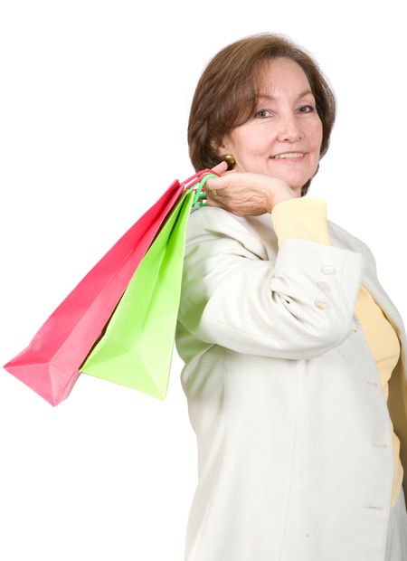business woman with shopping bags over a white background