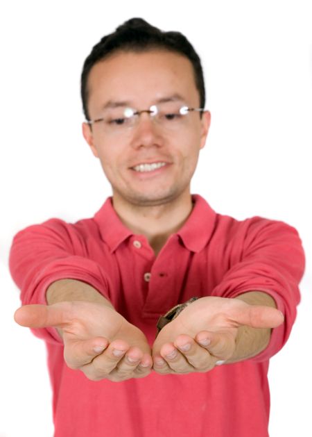 casual guy holding something on his hands over a white background - focus is on the hands