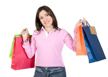 girl with shopping bags dressed in jeans and a pink top over white